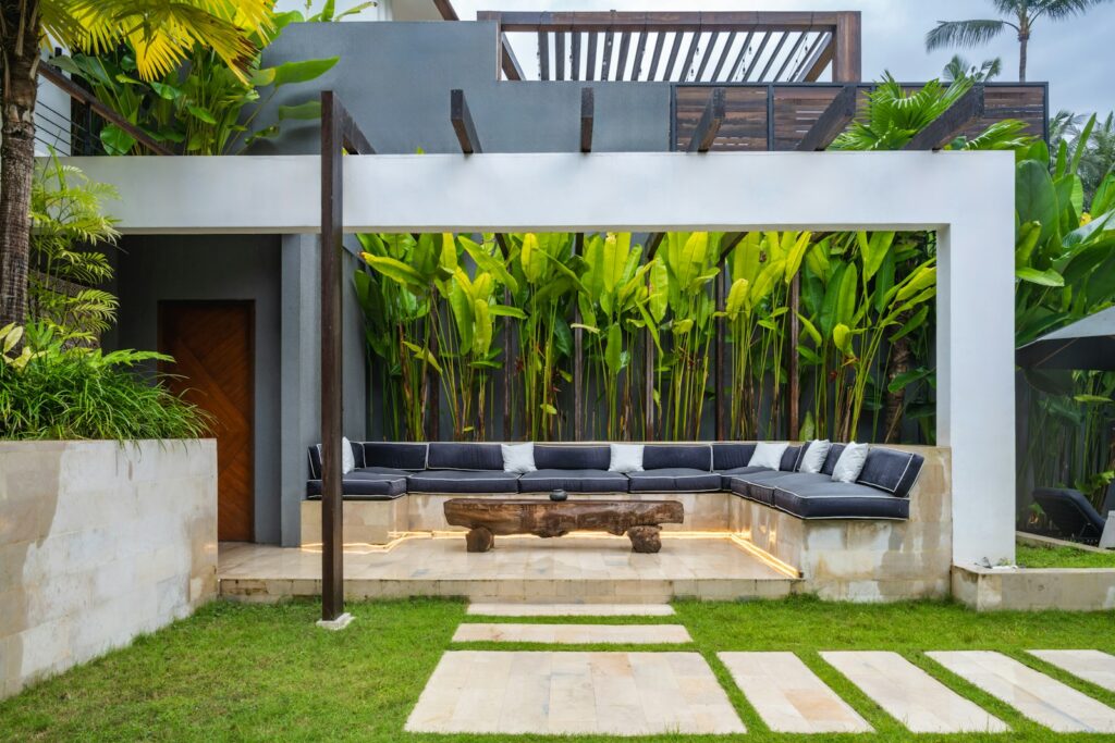 A patio with a couch and a table in it